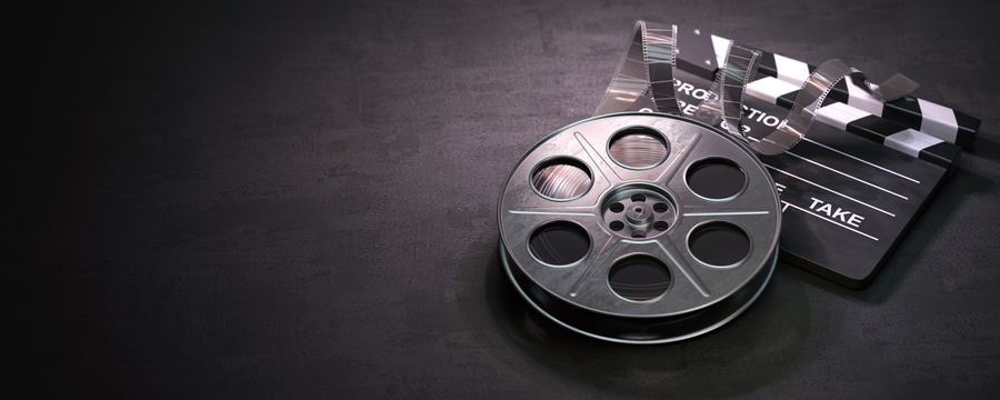 Bobina de cine y claqueta